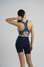 Load image into Gallery viewer, New Balance Womens Seamless Wirefree, Racerback Sports Bra with Removable Pads, Bottom Band with Logo, Camo Magnet