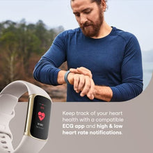 Load image into Gallery viewer, Fitbit Charge 5 Advanced Fitness &amp; Health Tracker with Built-in GPS, Stress Management Tools, Sleep Tracking, 24/7 Heart Rate and More, Lunar White/Soft Gold, One Size (S &amp;L Bands Included)
